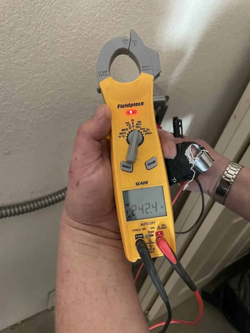 Voltage testing with clamp meter during Generator Installation in Lenoir
